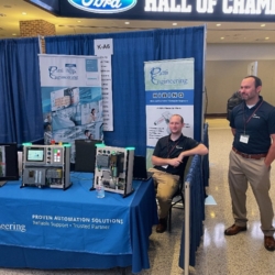 Engineering booth at a tradeshow featuring automation solutions and hiring information.