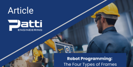 Engineer using laptop to control robotic arm in industrial setting.